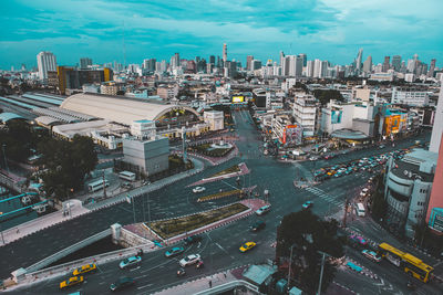 High angle view of city street and buildings against sky