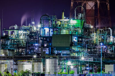 Illuminated factory at night