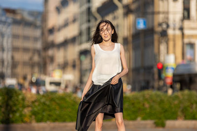 Woman with umbrella in city