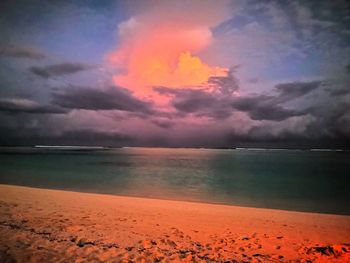 Scenic view of sea against dramatic sky