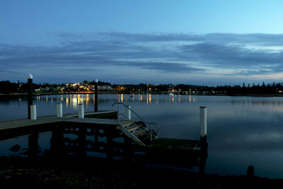 Scenic view of lake against sky at dusk