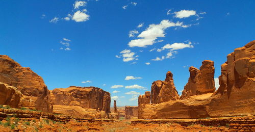 Scenic view of landscape against blue sky