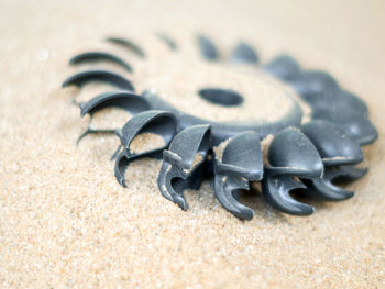 Old water turbine on dried sand without water, useless in drought condition