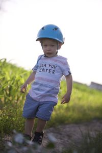 Boy standing on field