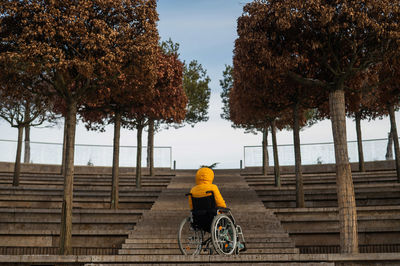 Rear view of woman walking on street