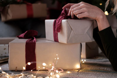 Midsection of woman holding gift