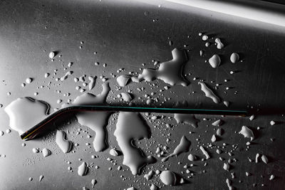 High angle view of raindrops on window at home