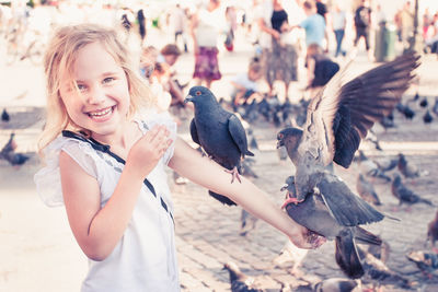 Portrait of a smiling girl in a city