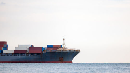 Boats in sea against sky