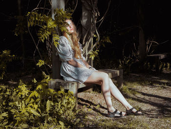 Woman sitting in a forest