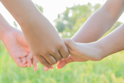 Midsection of woman holding hands