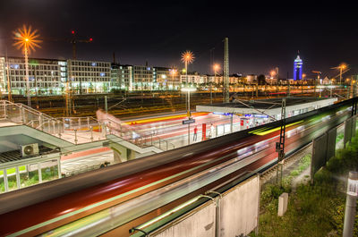 High angle view of light trails on road at night