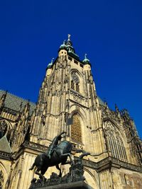Low angle view of statue against clear blue sky