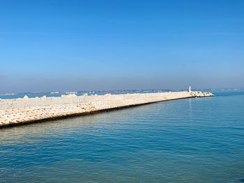 Scenic view of sea against blue sky