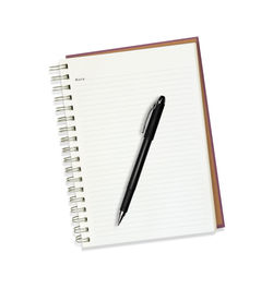 High angle view of pen on paper against white background