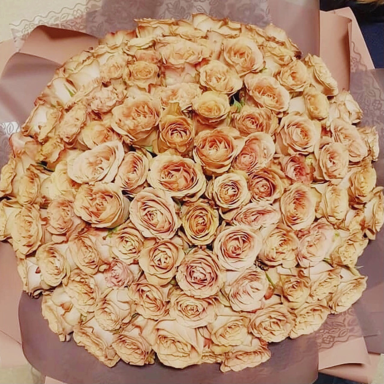 CLOSE-UP OF ROSE BOUQUET ON FLOOR