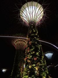 Low angle view of illuminated lights at night