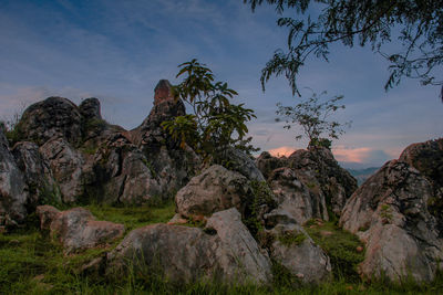 Rock formations on landscape against sky