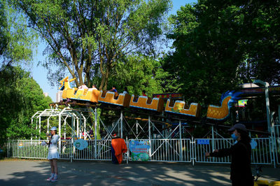 Rear view of people at amusement park