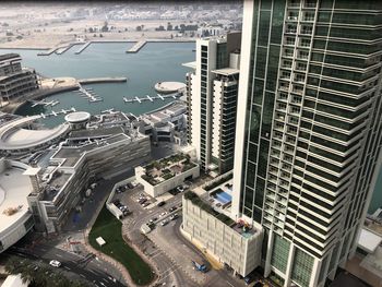 High angle view of cityscape by sea