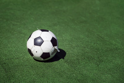 High angle view of soccer ball on grass