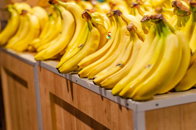 View of yellow bananas lying in supermarket. selective focus.