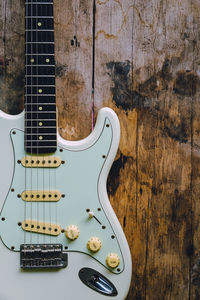 High angle view of guitar on table