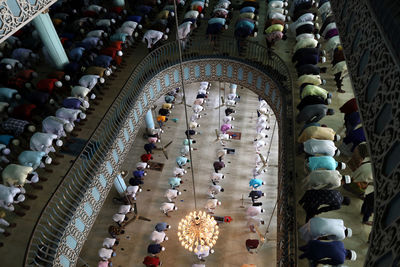 High angle view of people in illuminated building