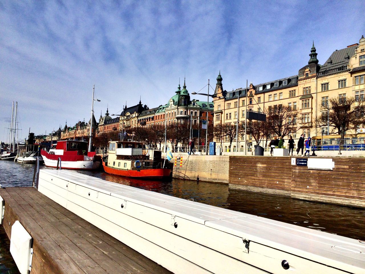 building exterior, architecture, built structure, nautical vessel, transportation, sky, mode of transport, water, boat, incidental people, travel, city, moored, travel destinations, tourism, day, outdoors, famous place, river