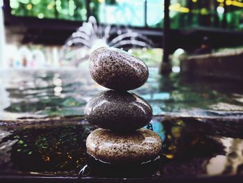 Close-up of stones on water