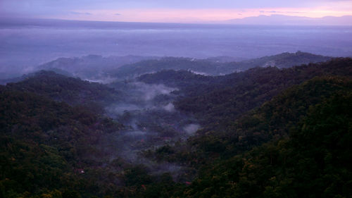 Scenic view of mountains against sky during sunset