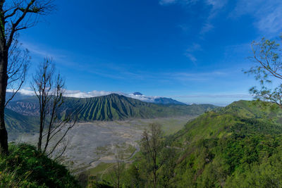 View of volcanic landscape against blue sky