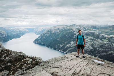 Rear view of man standing on mountain