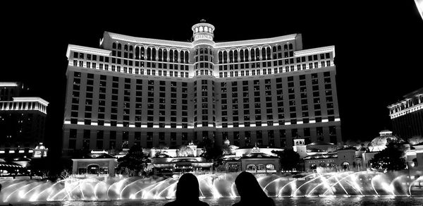 Group of people in front of building at night