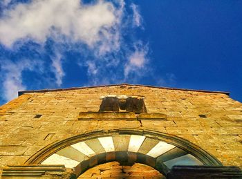 Low angle view of built structure against blue sky