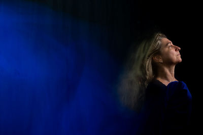 Time lapse view of woman moving a rag. long exposure, motion blur. 