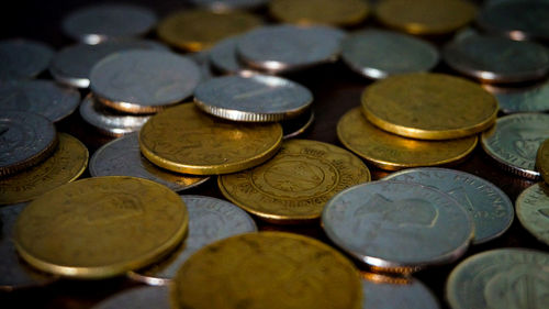 Close-up of coins on table