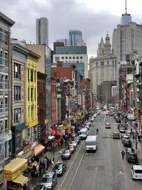 High angle view of city street and buildings against sky