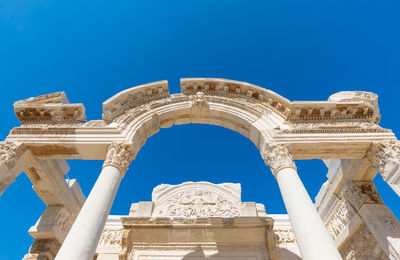 Low angle view of historical building against blue sky