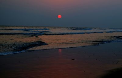 Scenic view of sea against sky at sunset