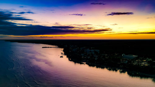 Scenic view of sea against romantic sky at sunset