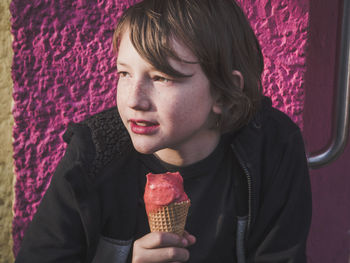 Portrait of young woman with ice cream