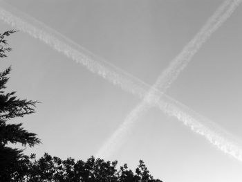 Low angle view of vapor trails in sky