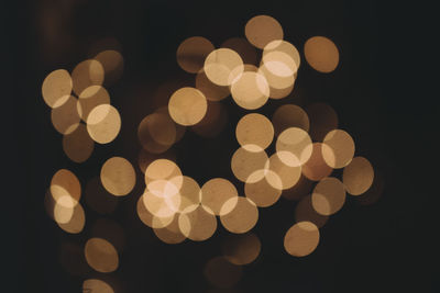 Defocused image of illuminated lights at night