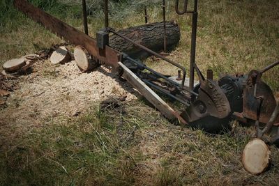 Old rusty machine on field