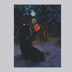 Woman standing by bonfire