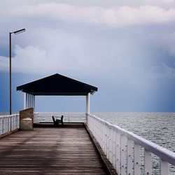 View of calm sea against cloudy sky