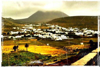 Scenic view of residential district against sky