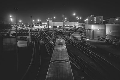 High angle view of trains and railroad tracks at night