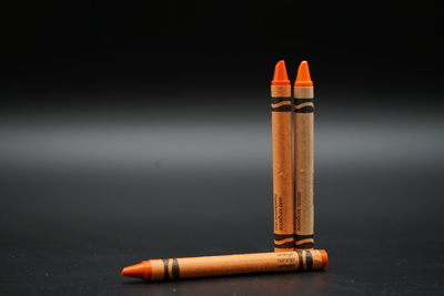 Close-up of cigarette against black background